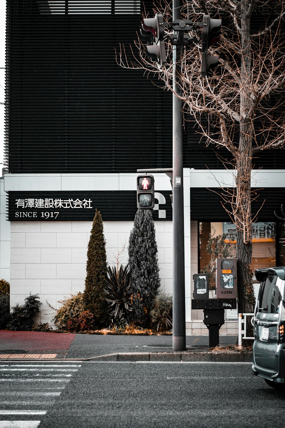 a car is parked in front of a building