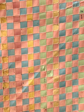 Vibrant chequered tiles arranged in a decorative pattern on a site.