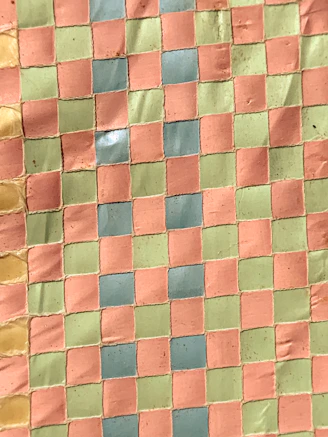 Close-up of a vibrant custom painted mat showcasing rich colors and detailed design.