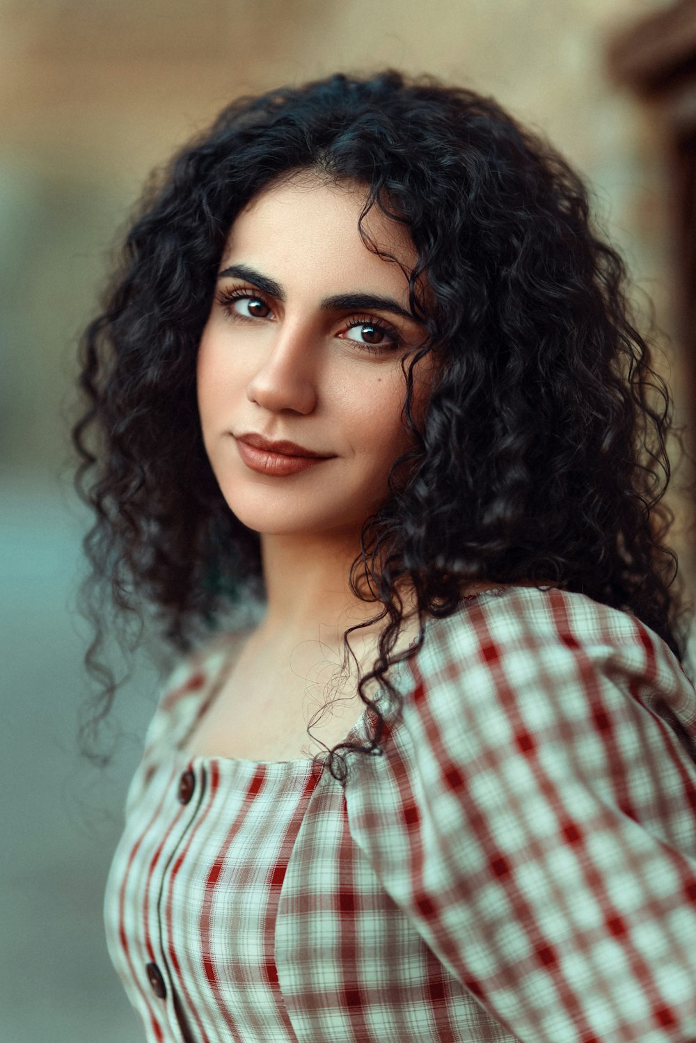 a close up of a person with curly hair