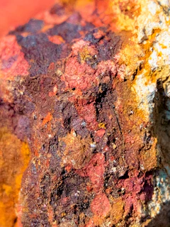 Detailed view of hand-painted rock textures showcasing depth and color variation.