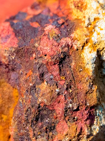 Detailed view of hand-painted rock textures showcasing depth and color variation.