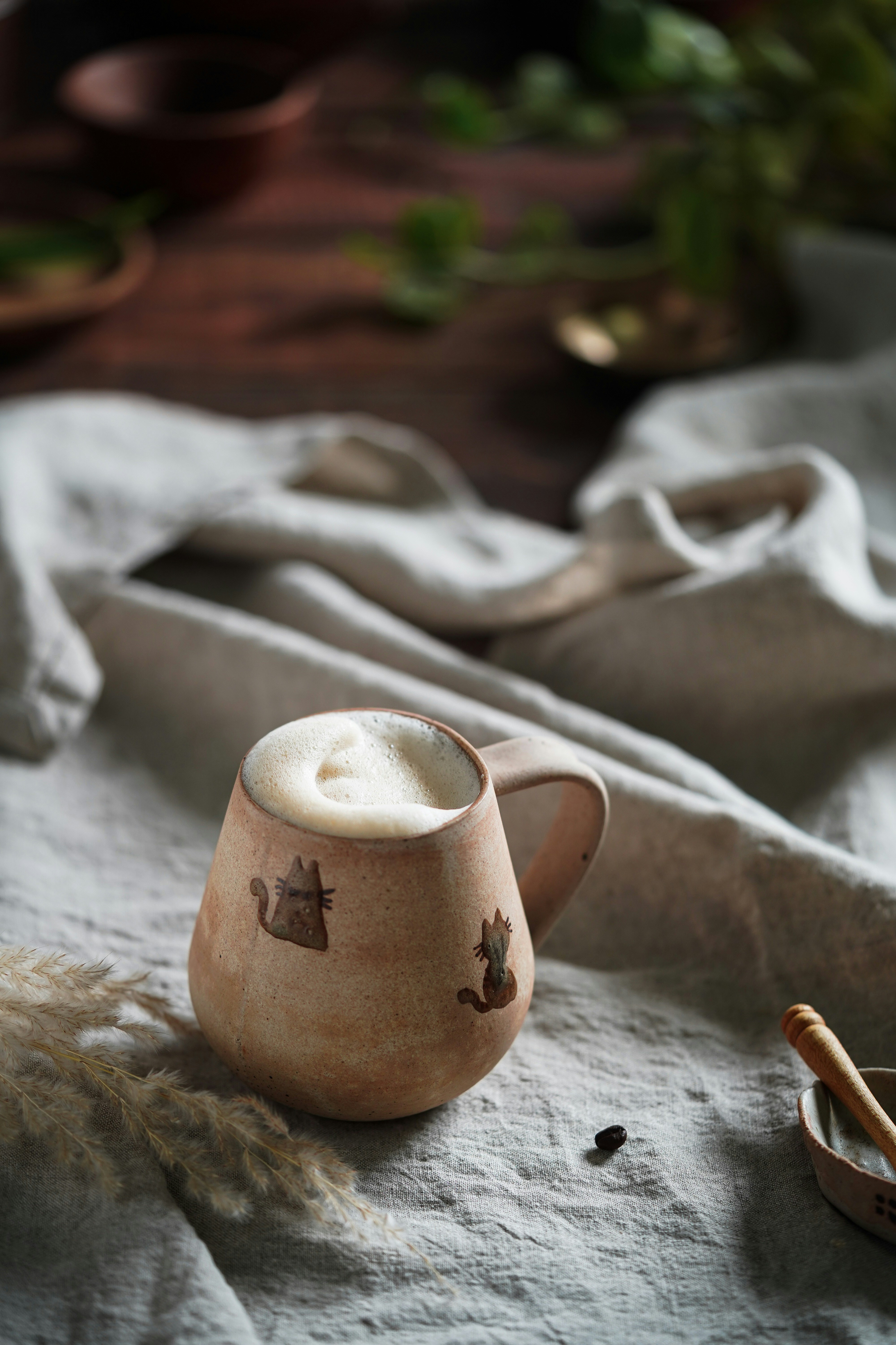 a cup of coffee sitting on top of a table