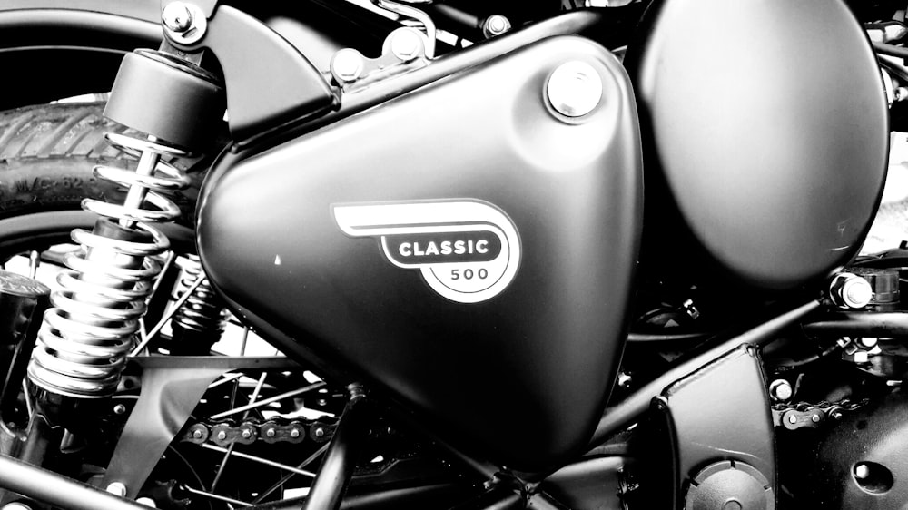 a black and white photo of a classic motorcycle