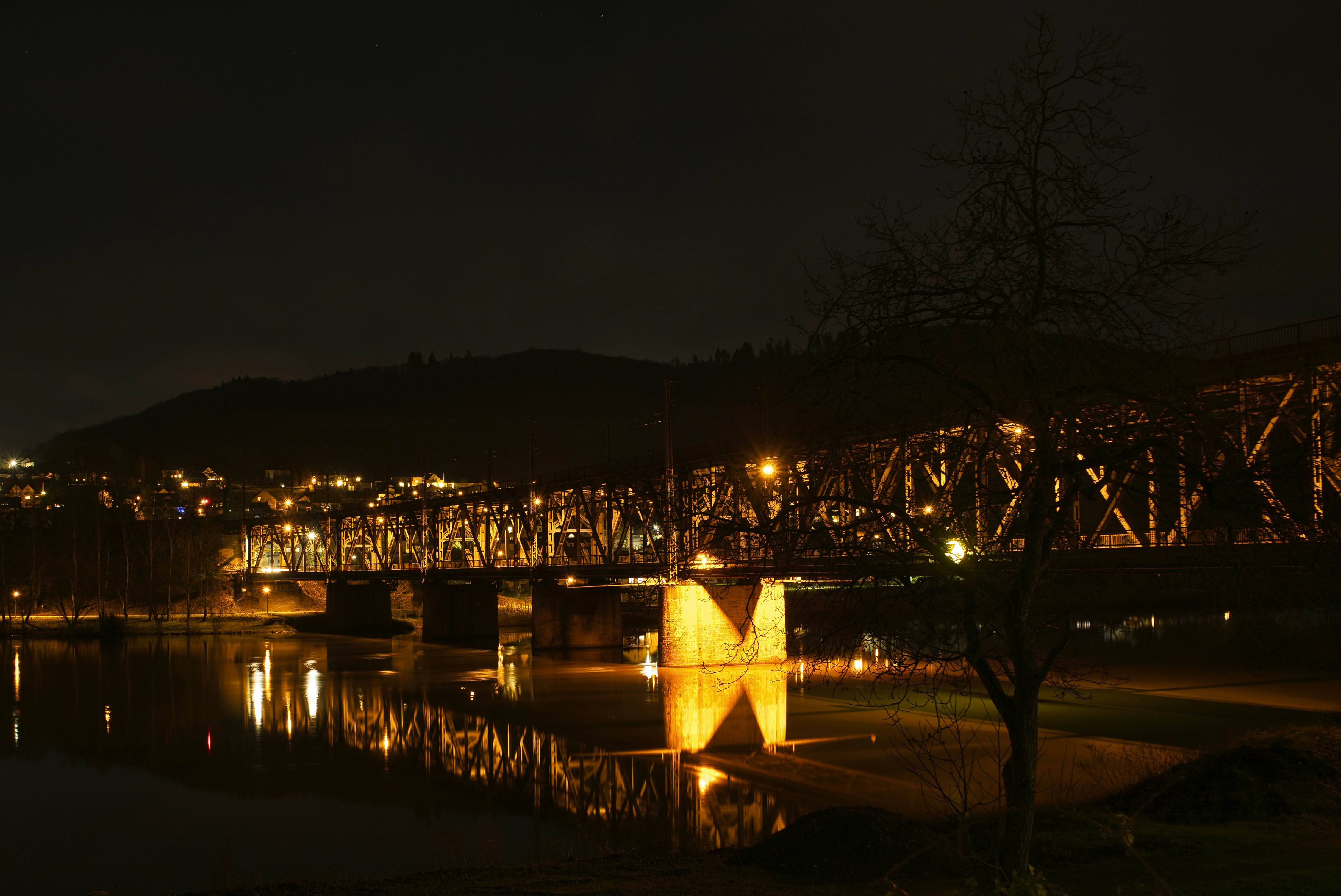 a bridge over a body of water at night