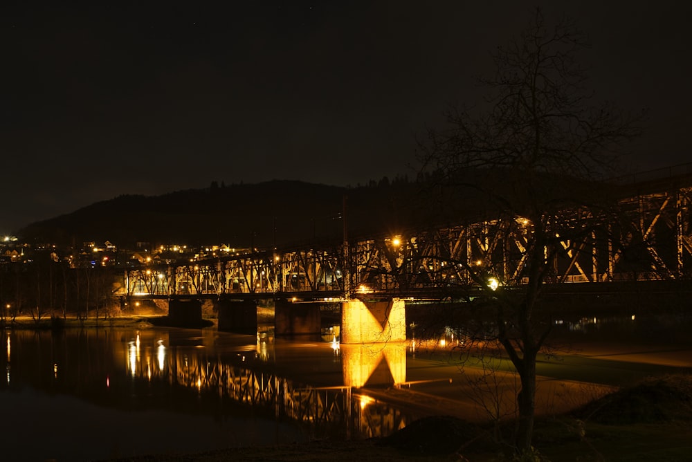 a bridge over a body of water at night