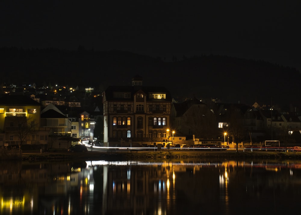 a view of a city at night from across a lake