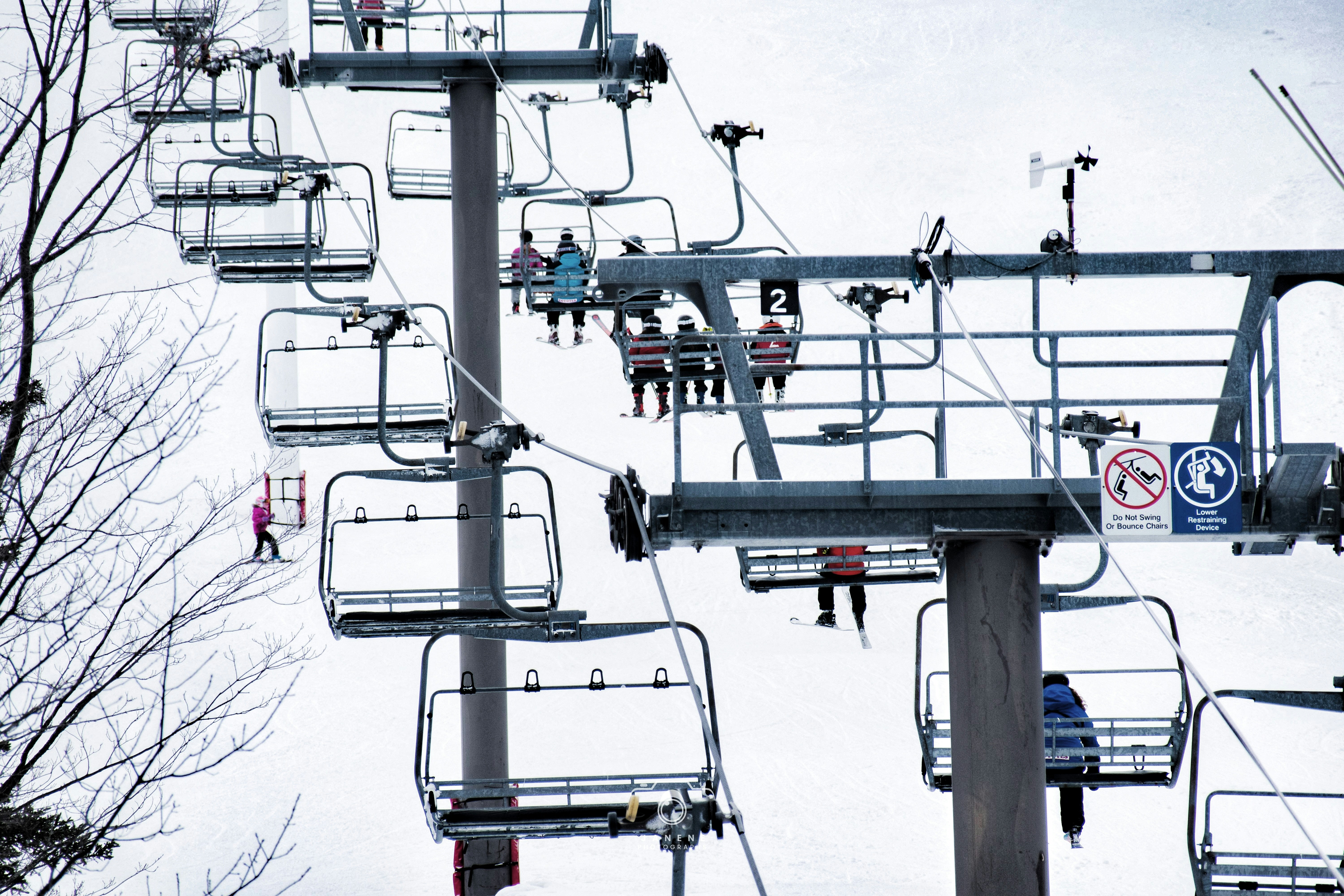 a group of people riding a ski lift