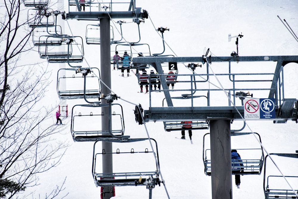 a group of people riding a ski lift