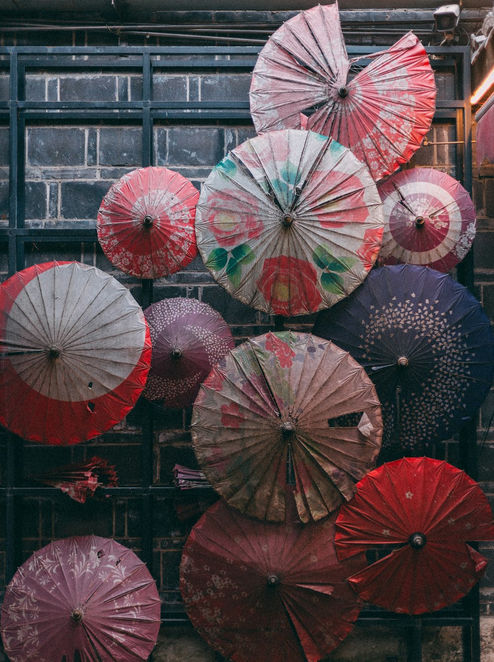 a bunch of umbrellas that are on a rack