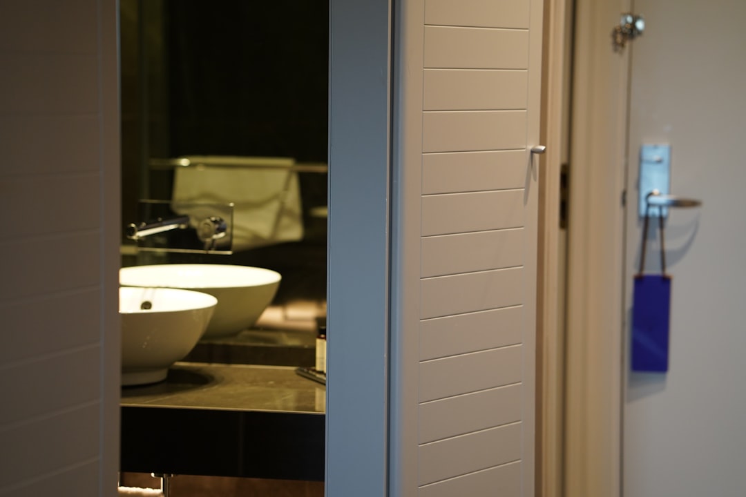a bathroom with a sink and a mirror,