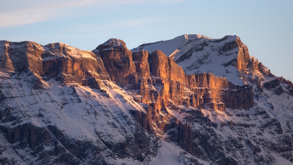 a snow covered mountain with a sky background