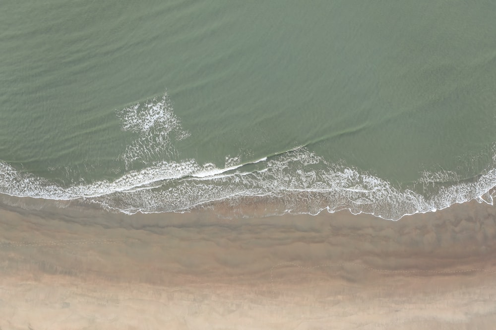 an aerial view of a beach and ocean