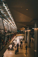 a group of people walking through an airport
