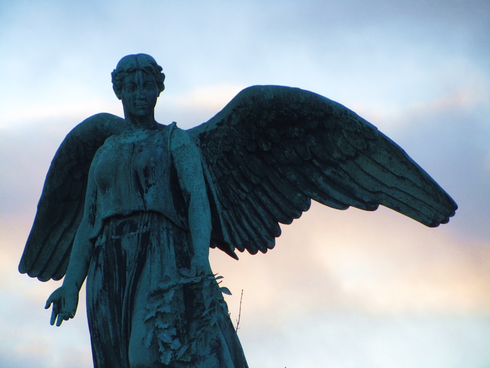 a statue of an angel with outstretched wings