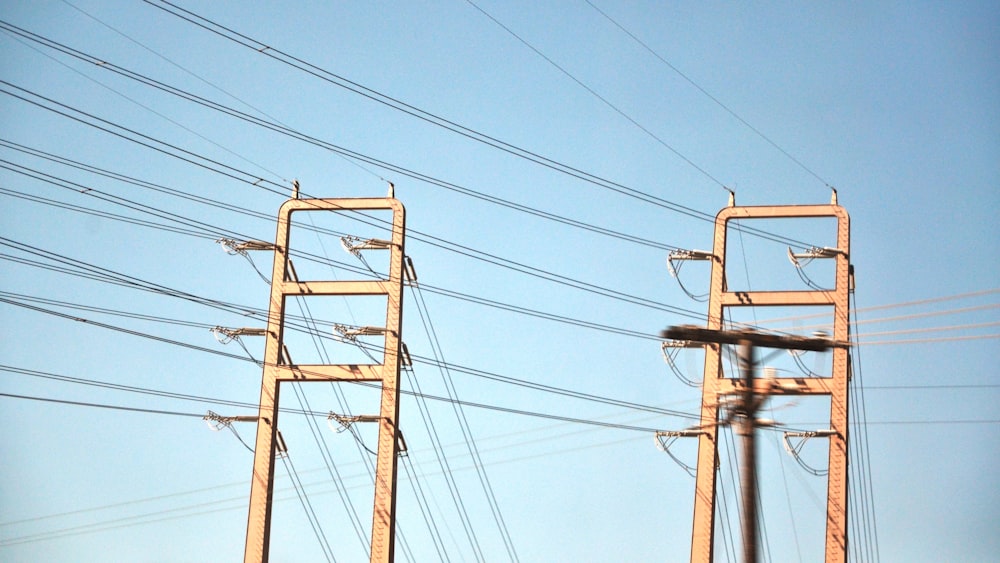 a couple of power lines with a sky background