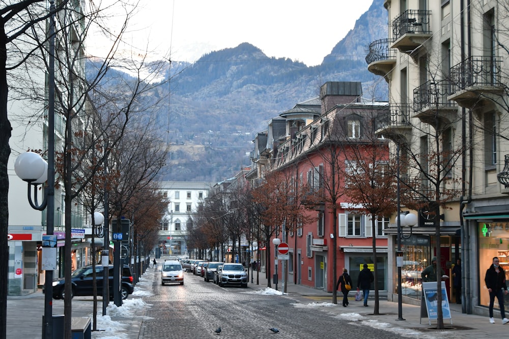 a city street with cars parked on the side of it