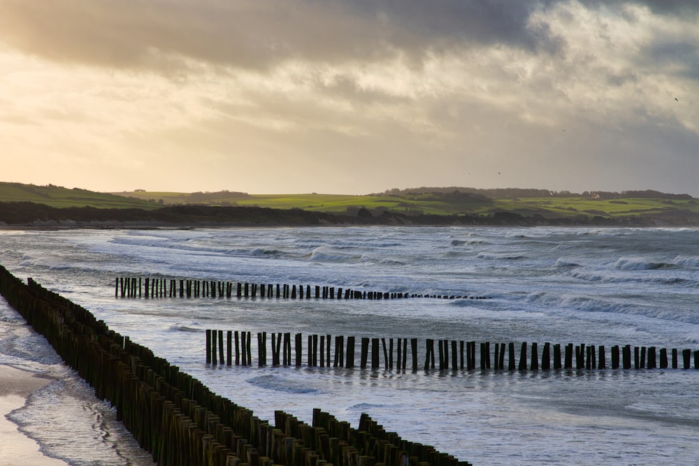 a beach with waves crashing on the shore