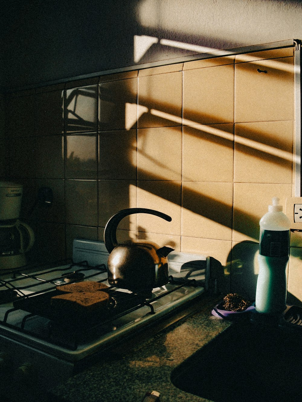 a tea kettle sitting on top of a stove