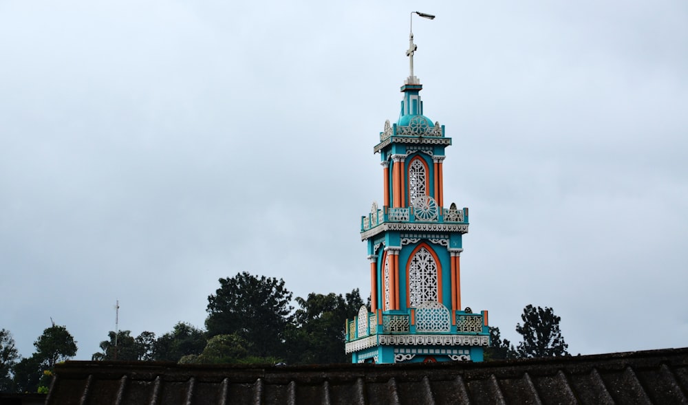 a tall tower with a clock on the top of it