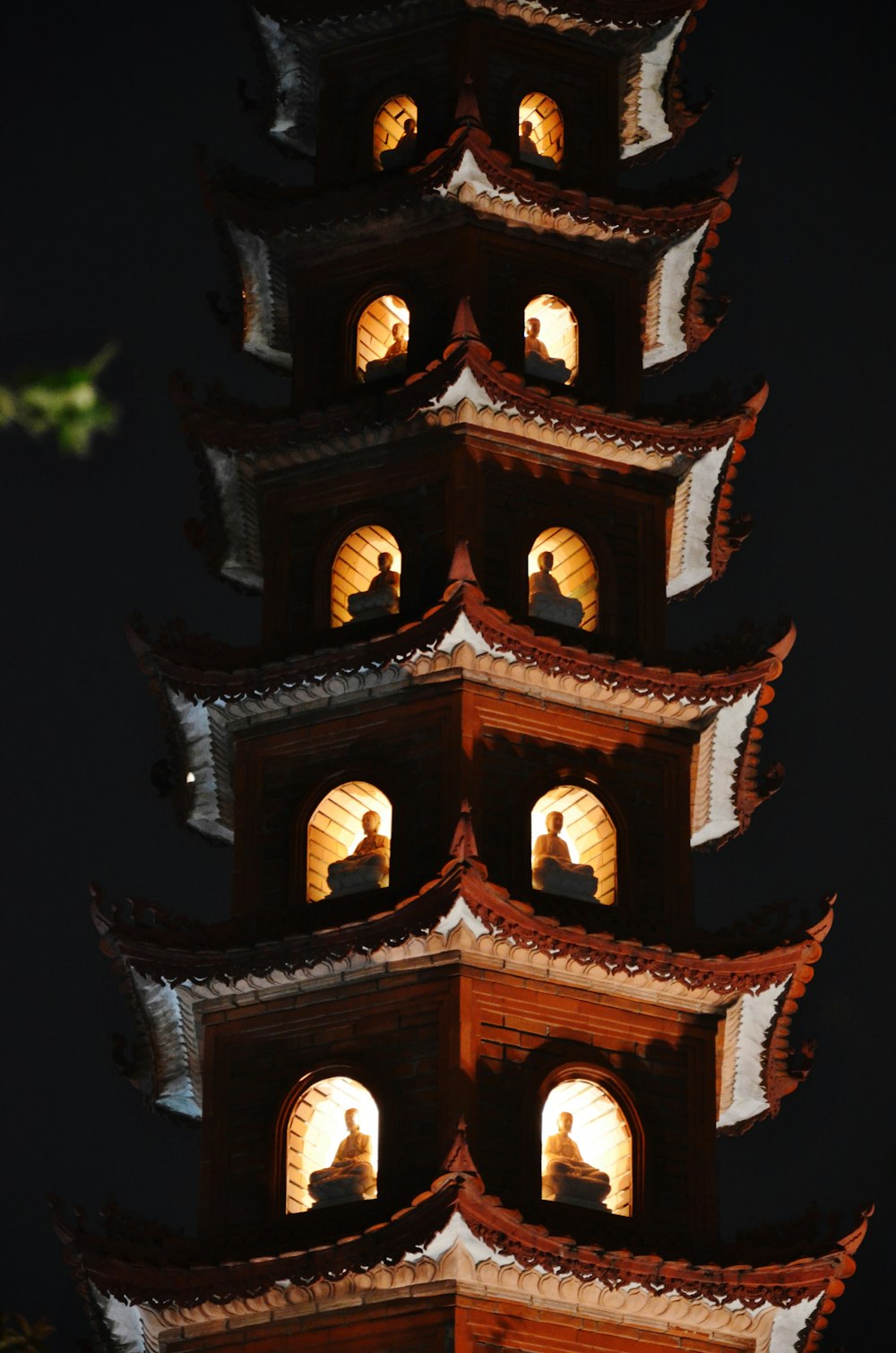 a tall tower with a clock on it's side