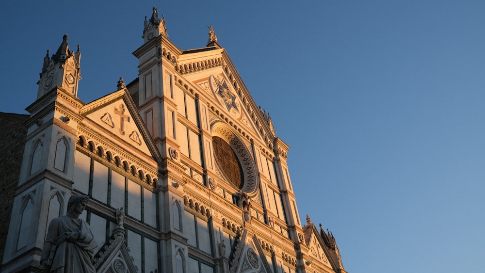 a very tall building with a clock on it's side