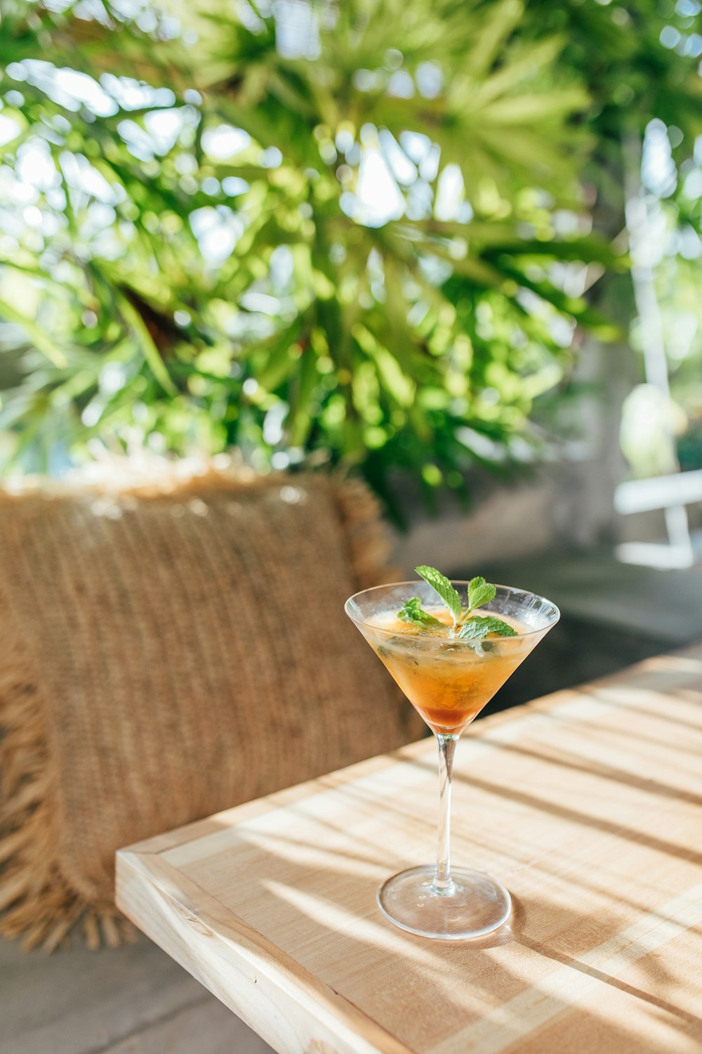 a drink sitting on top of a wooden table