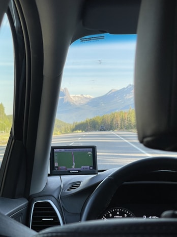 Close-up of a dashcam’s high-resolution screen displaying a clear highway view.