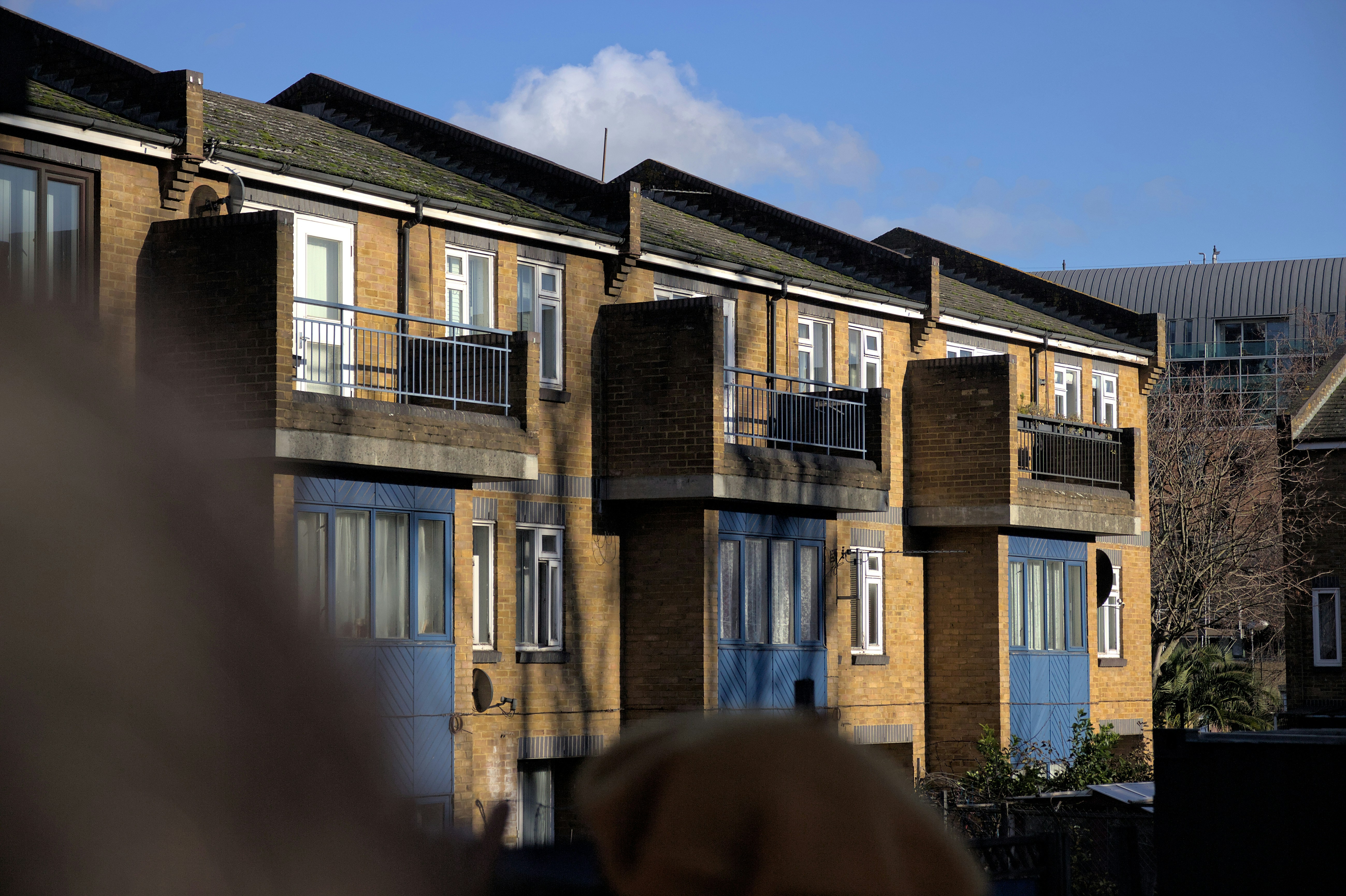a group of buildings with balconies and windows