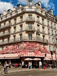 a tall building with many balconies on the top of it