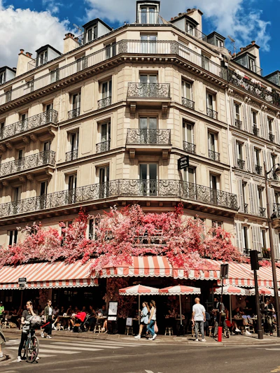 a tall building with many balconies on the top of it