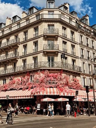a tall building with many balconies on the top of it