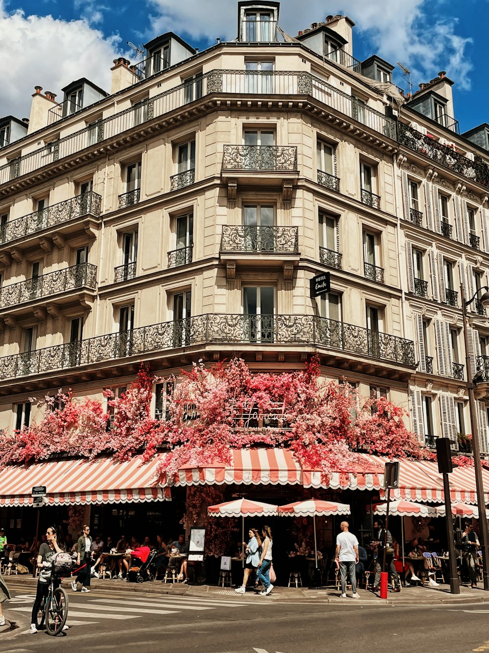 a tall building with many balconies on the top of it