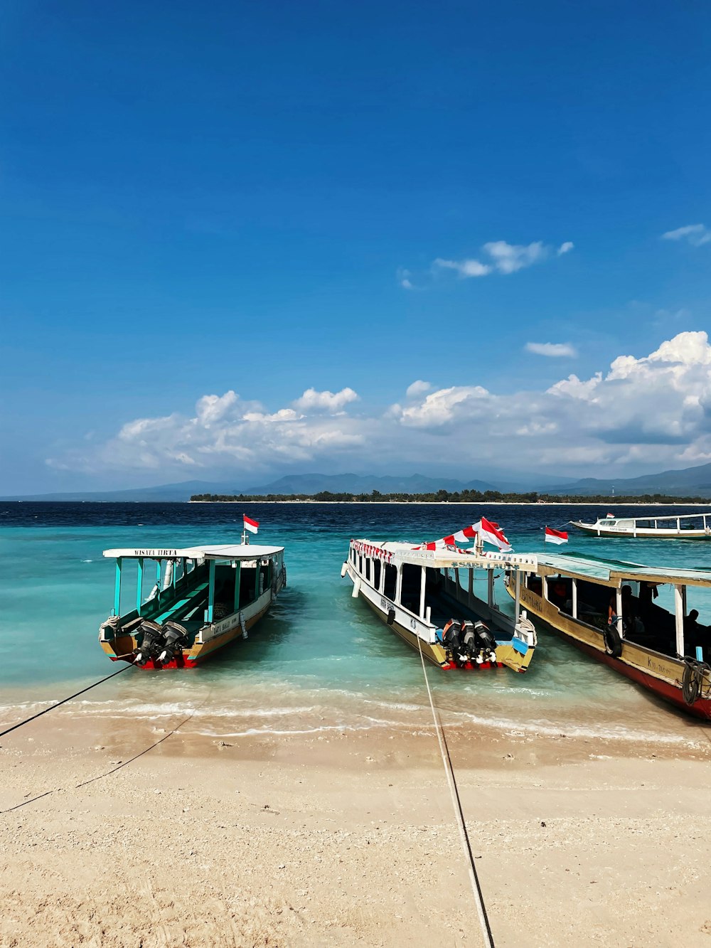 a couple of boats that are sitting in the water