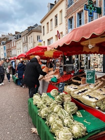a group of people standing around a market
