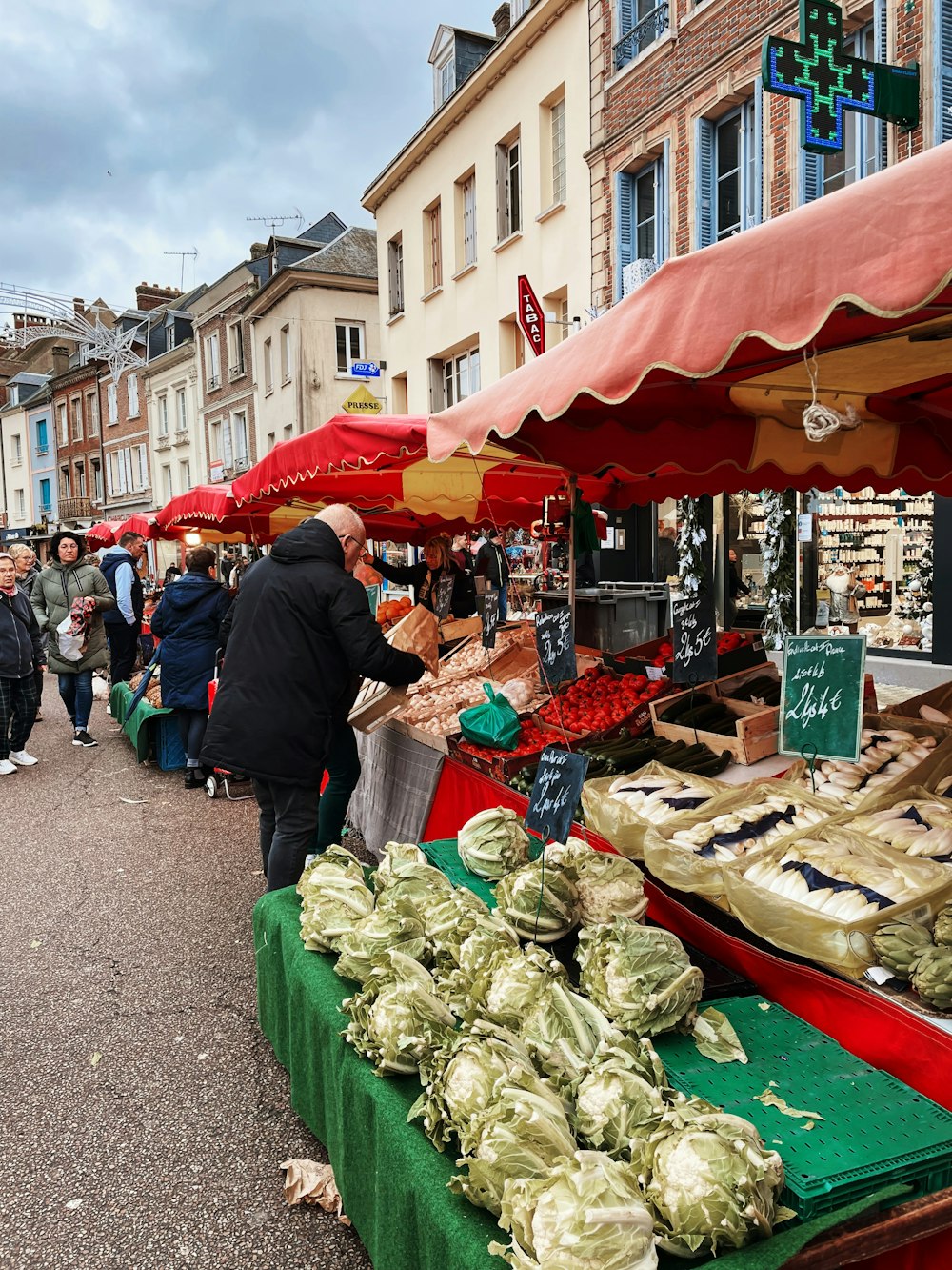 a group of people standing around a market