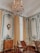 A beautifully decorated living room featuring elegant wall coverings and stylish wooden furniture.