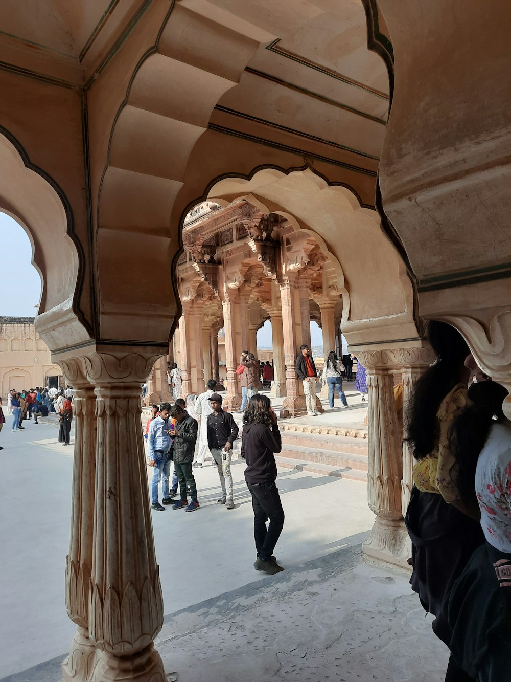 a group of people standing around a building