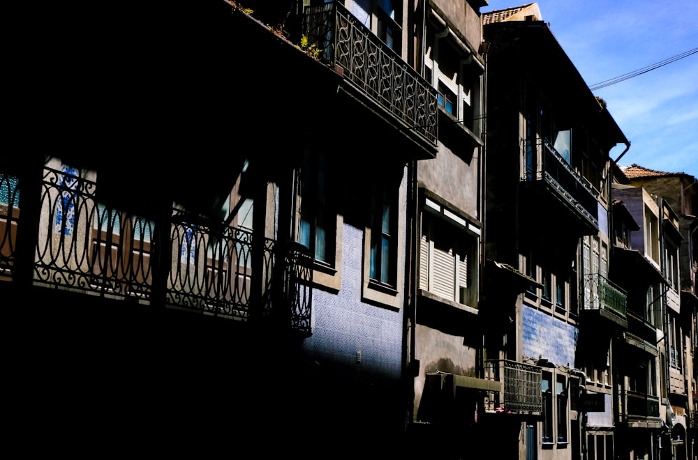 a row of buildings with balconies and balconies on the balcon