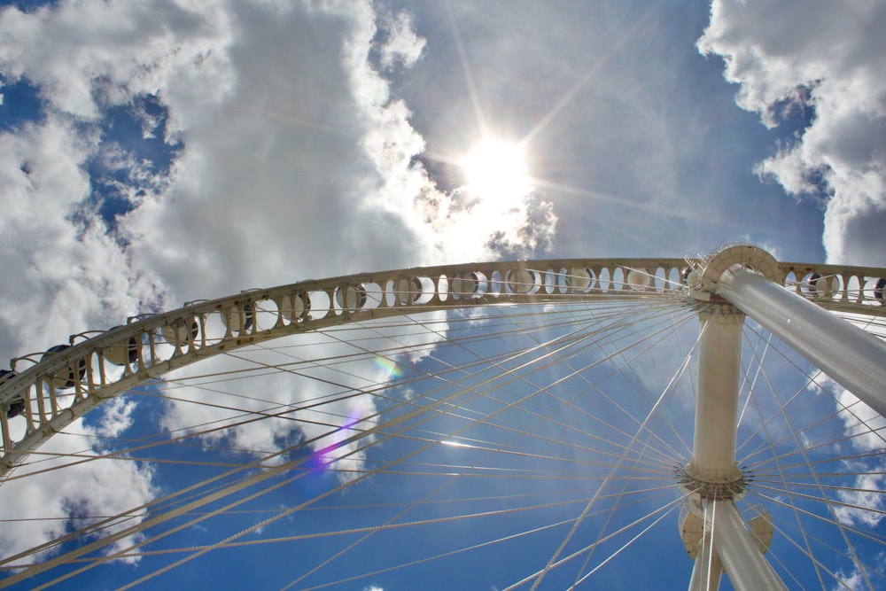 a large ferris wheel under a partly cloudy sky