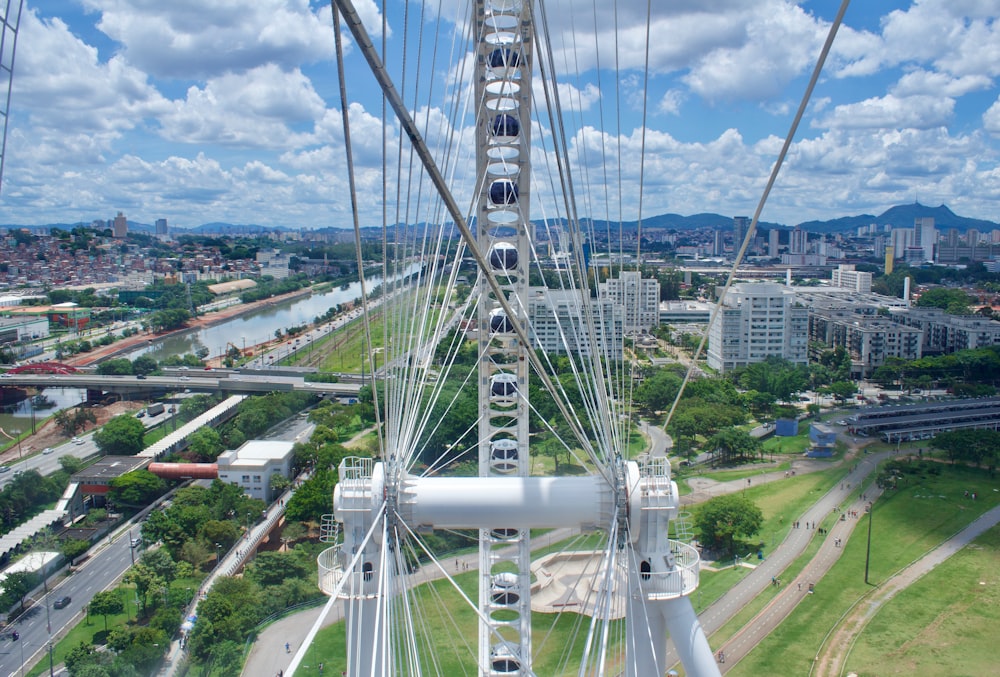 an aerial view of a ferris wheel in a city