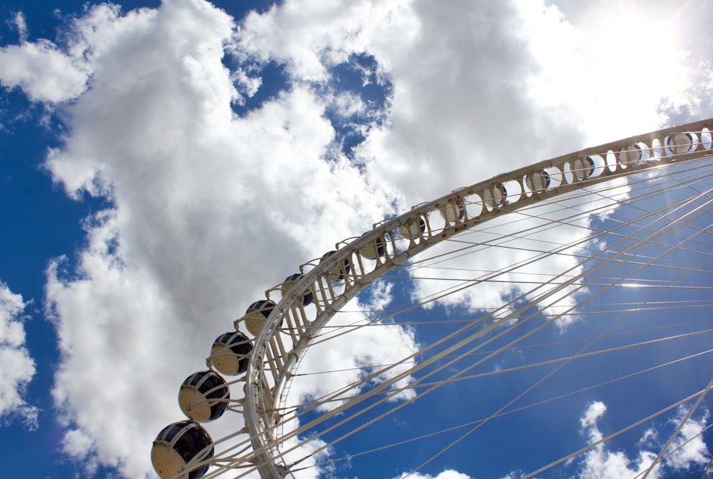 a ferris wheel with the sky in the background