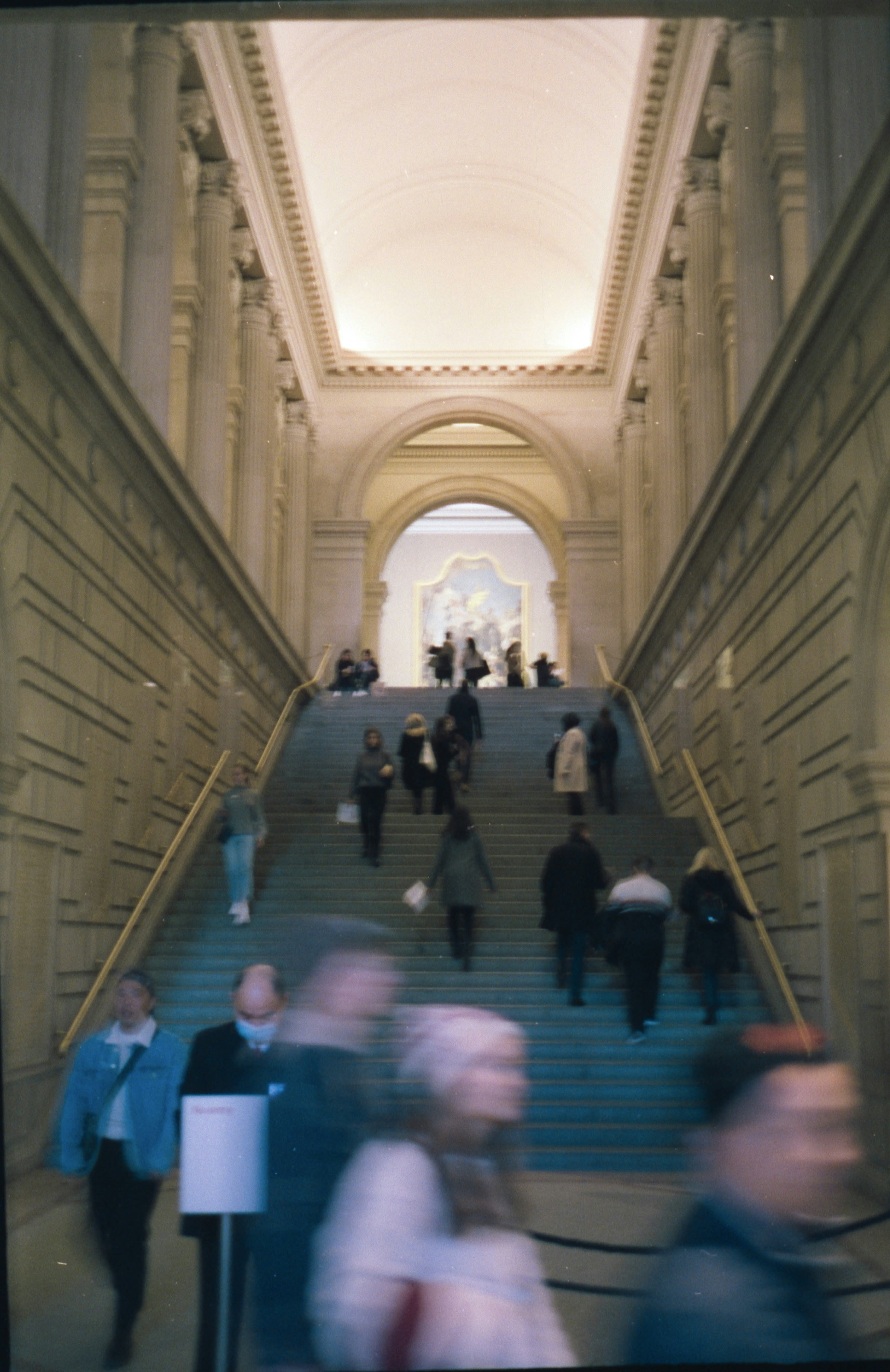 a group of people walking up a flight of stairs