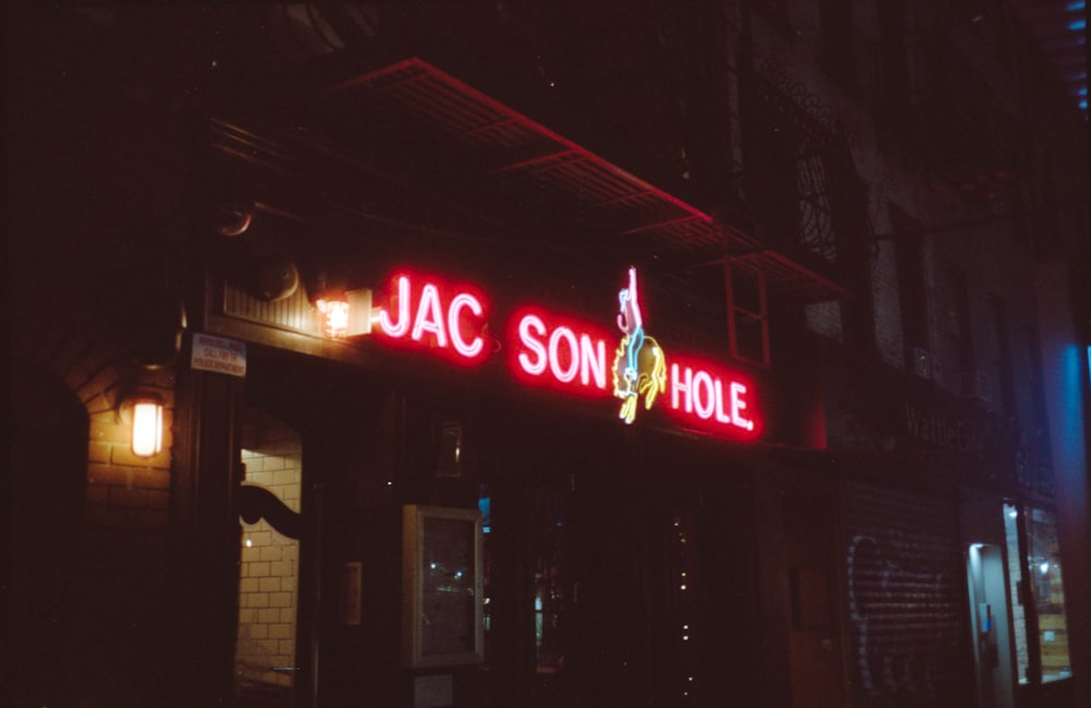 a neon sign on the side of a building