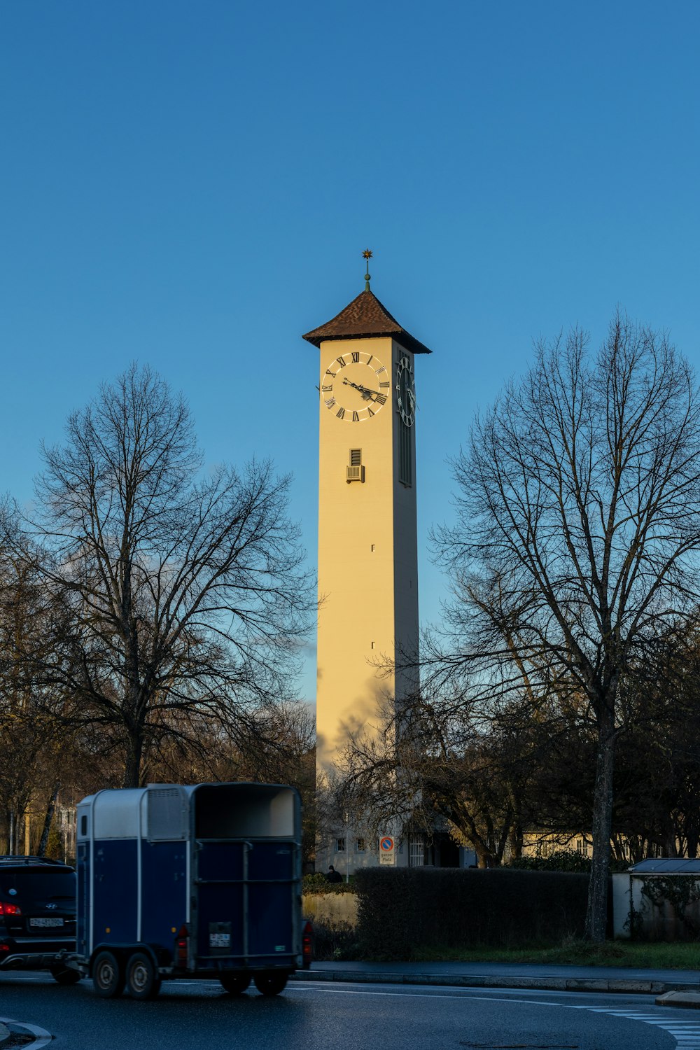 a large clock tower towering over a city street