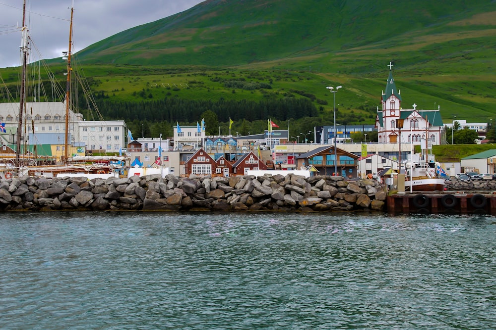 a large body of water with a bunch of buildings in the background