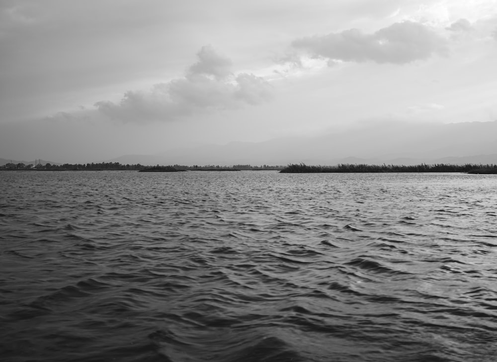 a black and white photo of a body of water