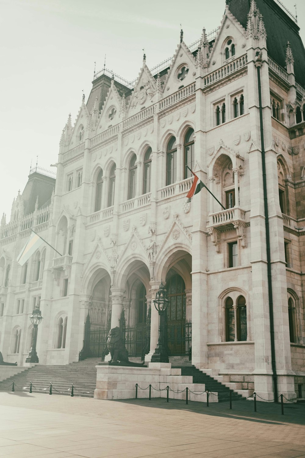 a large white building with a flag on top of it