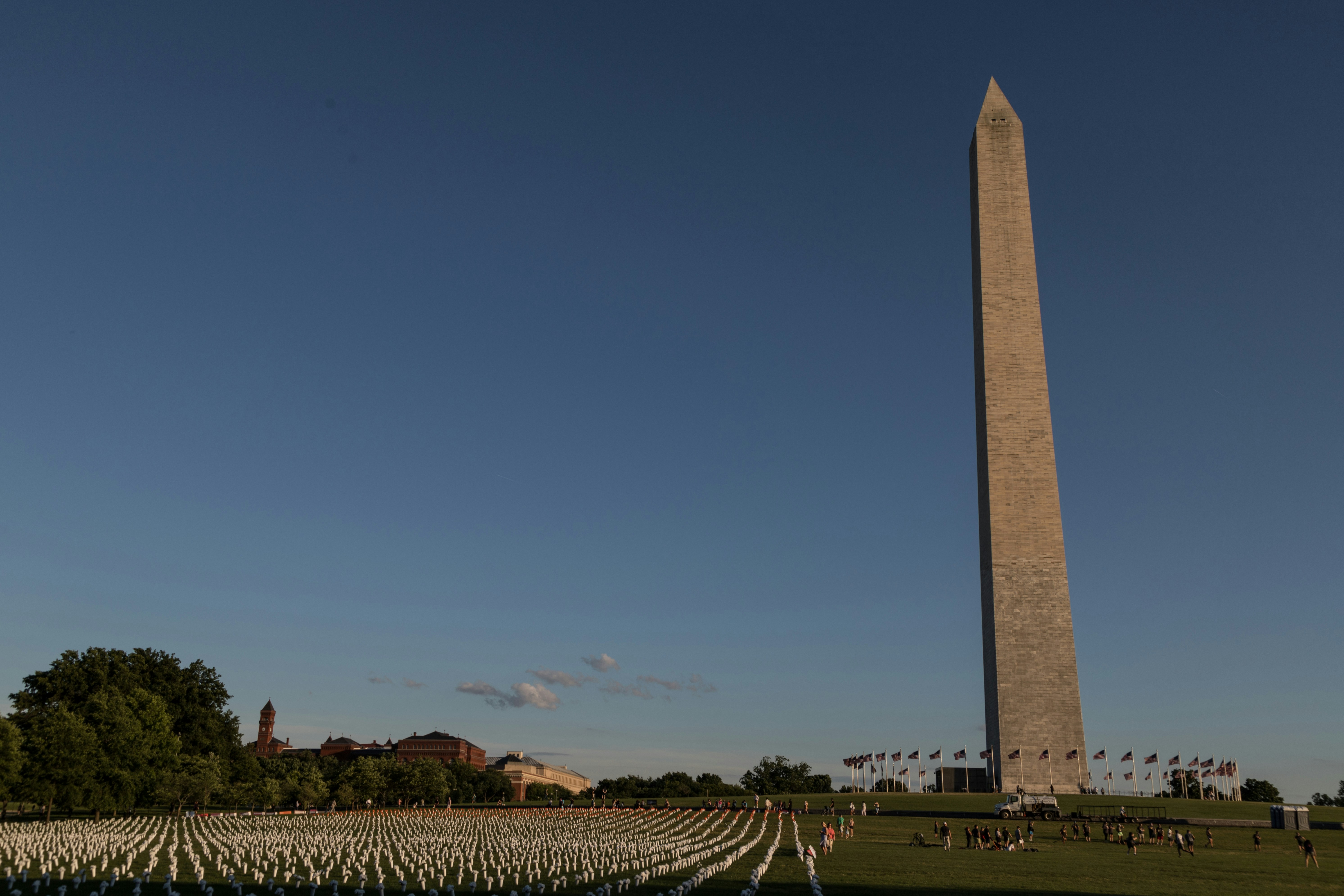 a large obelisk in the middle of a field