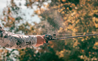 a man is spraying water on his hands